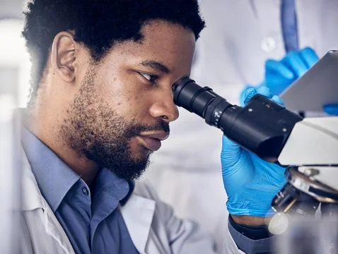 Black man, scientist and microscope with science research in laboratory, data Stock Photos