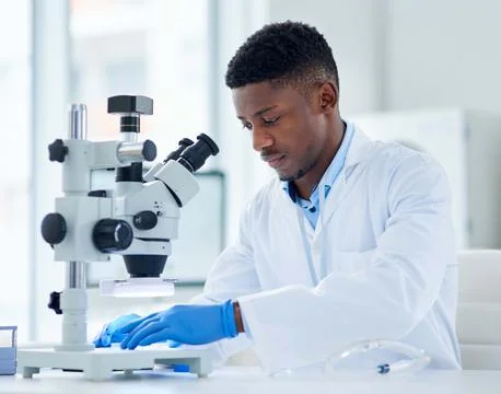 Black man, scientist and microscope for analysis, testing and study vaccine.. Stock Photos