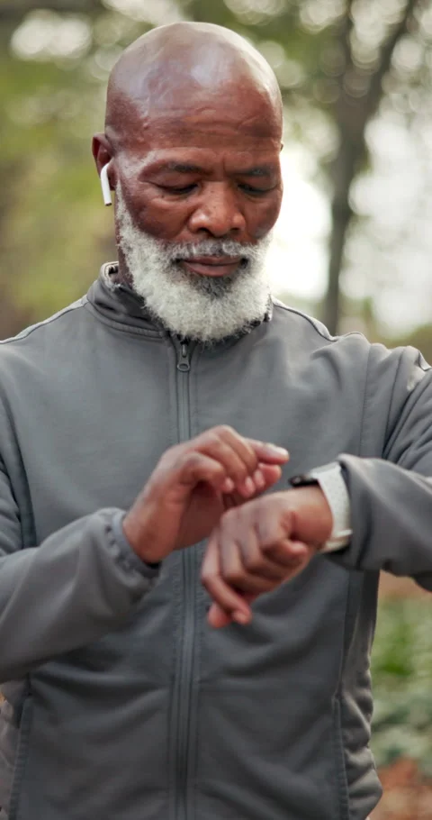 Black man, senior and smart watch with fitness outdoor, monitor health or Stock Footage 340966931
