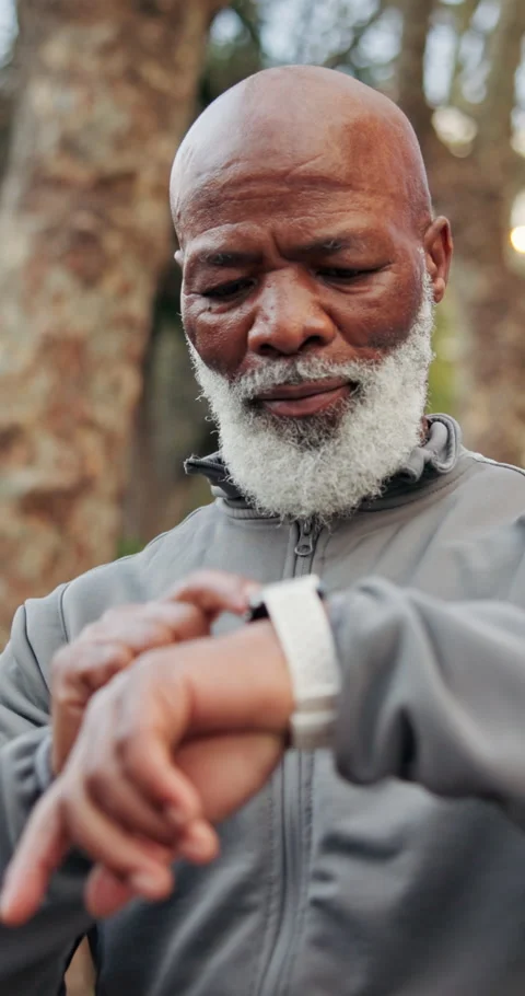 Black man, senior and smart watch with exercise outdoor, monitor health or Stock Footage 340968616