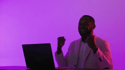 Black Man Sitting at Desk Working on Laptop Computer. African American Man Stock-Footage 231434539