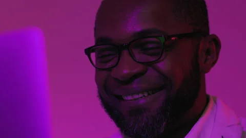 Black Man Sitting at Desk Working on Laptop Computer. African American Man Stock-Footage 231440624