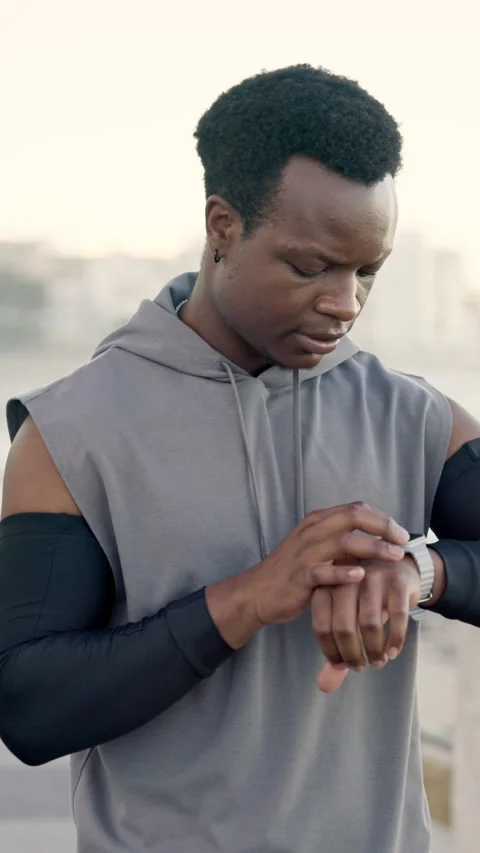 Black man, smart watch and runner at beach, fitness and smile with timer on Stock Footage 327358418