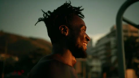 Black man smiling during sunset Stock Footage 279298521