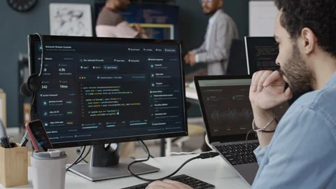 Black Man Software Developer Coding on Computer in Office Stock Footage 337476110