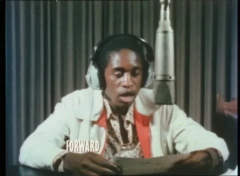Black man speaking different language in broadcast, London, UK, 1980 Video stock 159442747