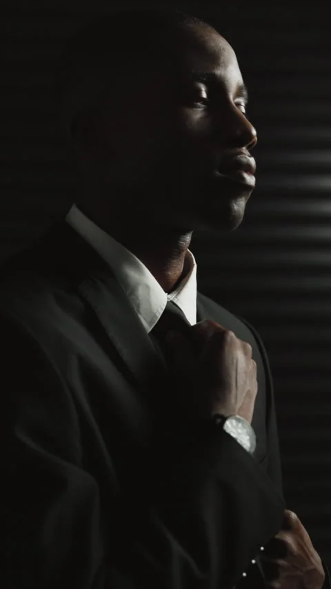 Black man, spy and suit with thinking for secret mission, espionage and danger Stock Footage 333680018