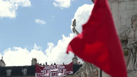 Black man stands against white supremacy banner (Paris, France) Stock Footage 132779110