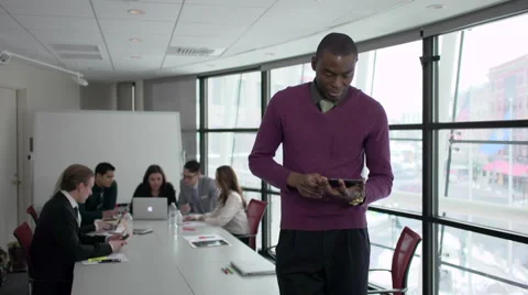 A Black Man Stands Infront of Professionals in a Meeting (4 of 4) Stock Footage 47628527