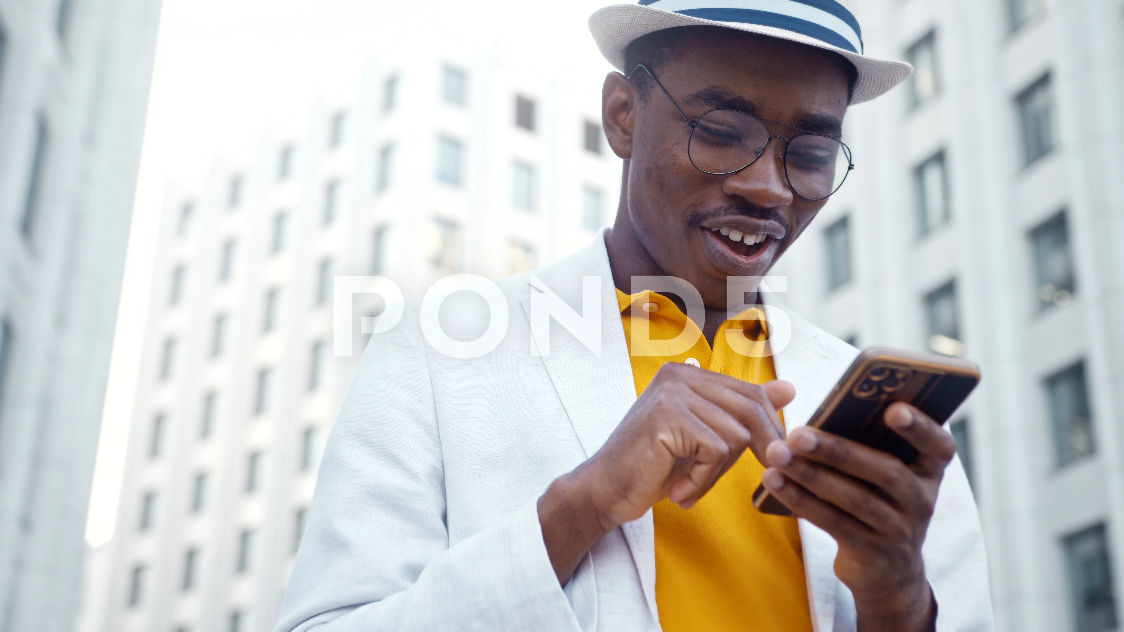 black man in suit and hat