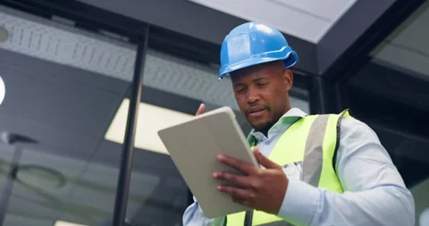 Black man, tablet and engineer on office with typing, notes and low angle for Stock Footage 336204878