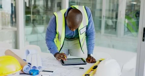 Black man, tablet and review floor plan, construction or architect working on Stock Photos