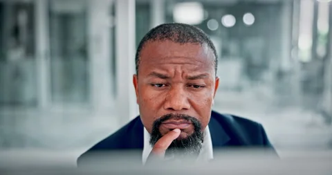 Black man, thinking and reading in office with computer for problem solving, Stock Footage 321445729