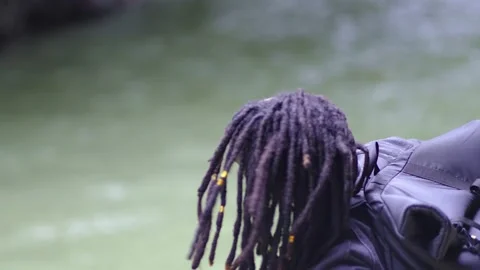 A Black Man Try to Tidy His Hair and Do Looking Around After Stock Footage 207720974