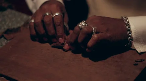 Black man twisting cigars closeup 스톡 동영상 62751819