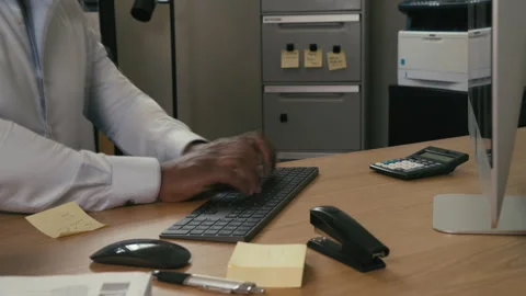 Black man typing on the keyboard and working in his office timelapse Stock Footage 264321468