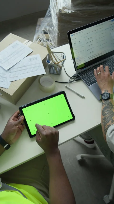 Black Man Using Green Screen Tablet in Logistics Warehouse Office Stock Footage 337308827
