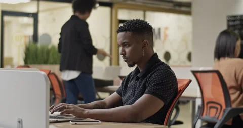 Black man using laptop during inspection Stock Footage 195220517
