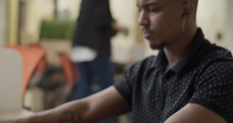 Black man using laptop in office Stock Footage 195218658