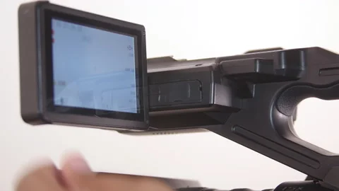 Black man using larger viewfinder on Camcorder Stock Footage 140946931