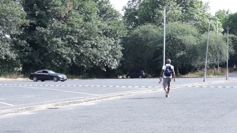Black man walking away Stock Footage 93651535