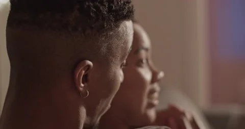 Black man watching comedy with girlfriend Stock Footage 181715251