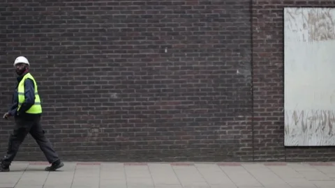 Black Man Worker Walking Stock Footage 77249125