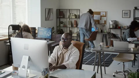 Black Man Working on Desktop Computer in Modern Open Office Stock Footage 348155461