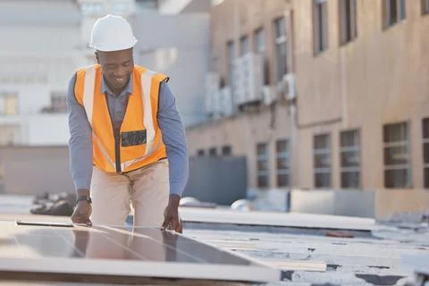 Black man working, engineer and solar panel electrician with sustainable Foto stock