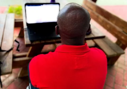 The black man working with his computer Stock Photos