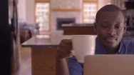 Black Man Working From Home On Laptop In Kitchen Stock Footage