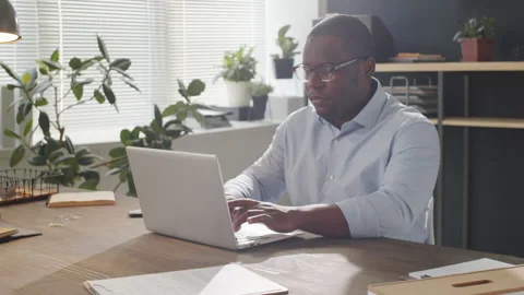 Black Man Working on Laptop in Office Stock Footage 143007623