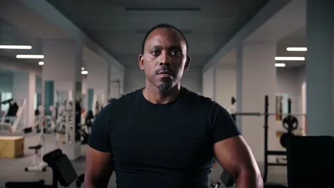 Black man workout with dumbbell training shoulders in gym.Bodybuilder training Stock Footage 225716964