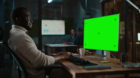 Black Man Works on Computer with Green Screen in Creative Offic 스톡 동영상 143745234