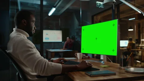 Black Man Works on Computer with Green Screen in Creative Offic 스톡 동영상 143745410