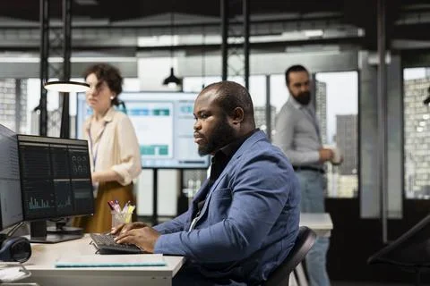 Black manager uses digital technology to forecast business performance Stock Photos