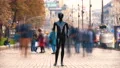 The black mannequin standing in a people crowd outdoor. time lapse 4k or 4k+ Resolution