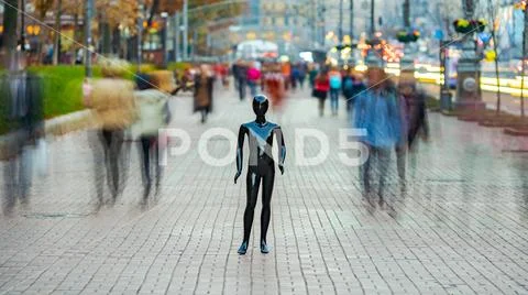 The black mannequin standing in a people crowd outdoor Stock Photos