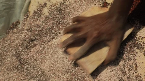 Black man's hands grinds stone into small pieces, manual stone grinding process. Stock-Footage 211428096