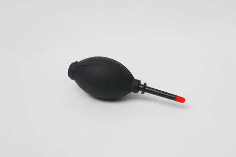 Black manual blower for cleaning the camera lens on a white background Stock Photos