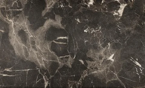 Black marble pattern, natural stone texture with white fibers. Stock Photos