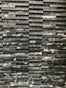 Black Marble Piece with natural pattern and texture on the wall background Stock Photos
