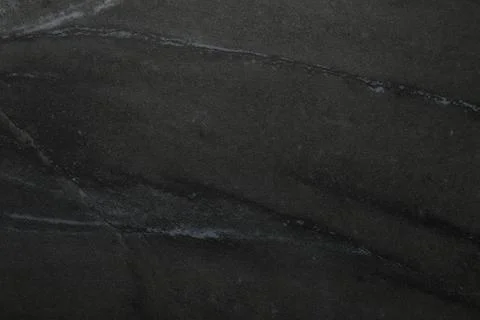 Black marble surface as background, closeup view Stock Photos