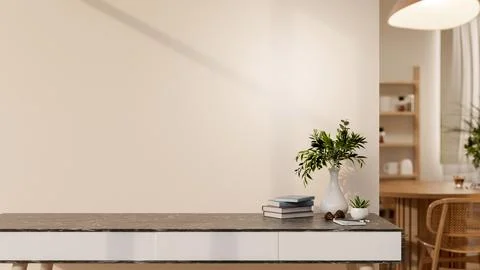 A black marble table or counter with books and potted plants in front of a .. Stock Illustration