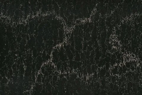 Black marble texture background pattern top view. Stone granite wall with bright Stock Photos