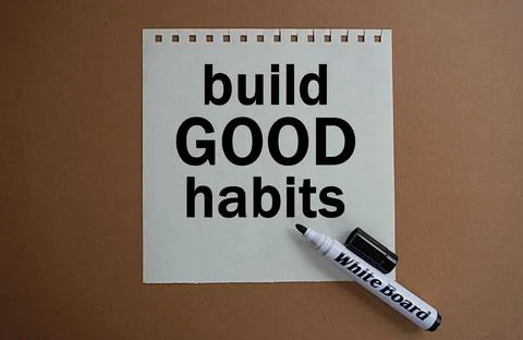 Black marker and note written build good habits, self-development concept Stock Photos