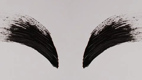 Black mascara stroke. Macro shot a of a black mascara isolated on white backg Stock Footage 258931431