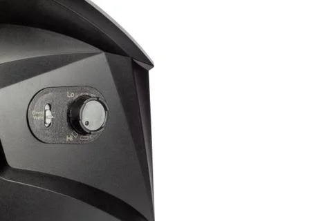 Black mask to perform welding work on a white background, view from the side. Stock Photos