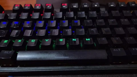 A black mechanical gaming keyboard with vibrant RGB LED Stock Footage 335314623