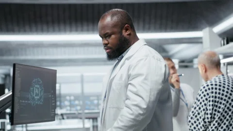 Black medic using artificial intelligence to observe effect during new drug test Stock Footage 319365324